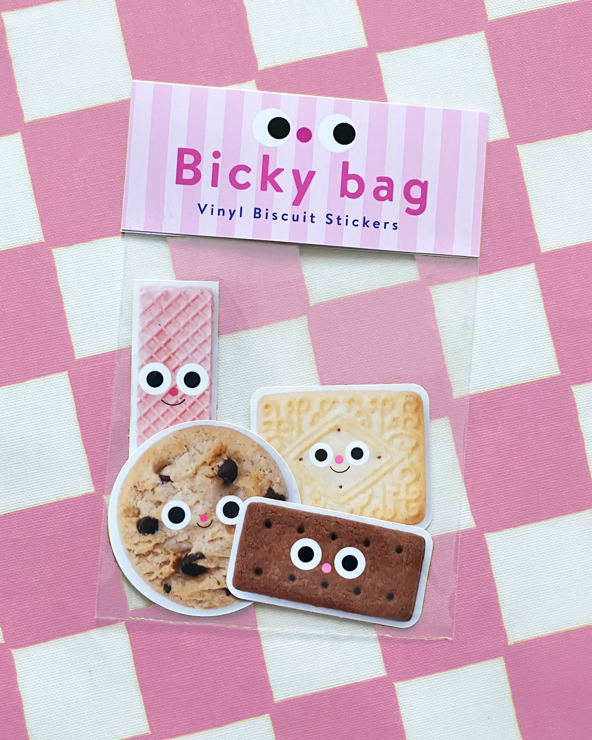Pack of vinyl biscuit stickers with a 'Bicky bag' label on a pink and white checkered background.
