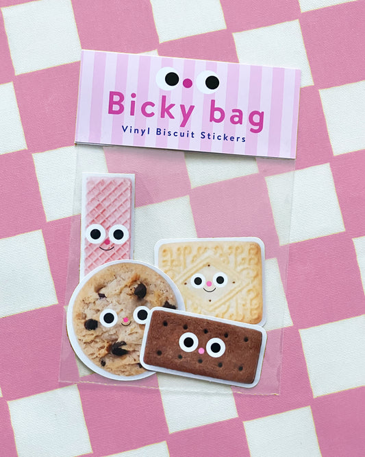 Pack of vinyl biscuit stickers with a 'Bicky bag' label on a pink and white checkered background.